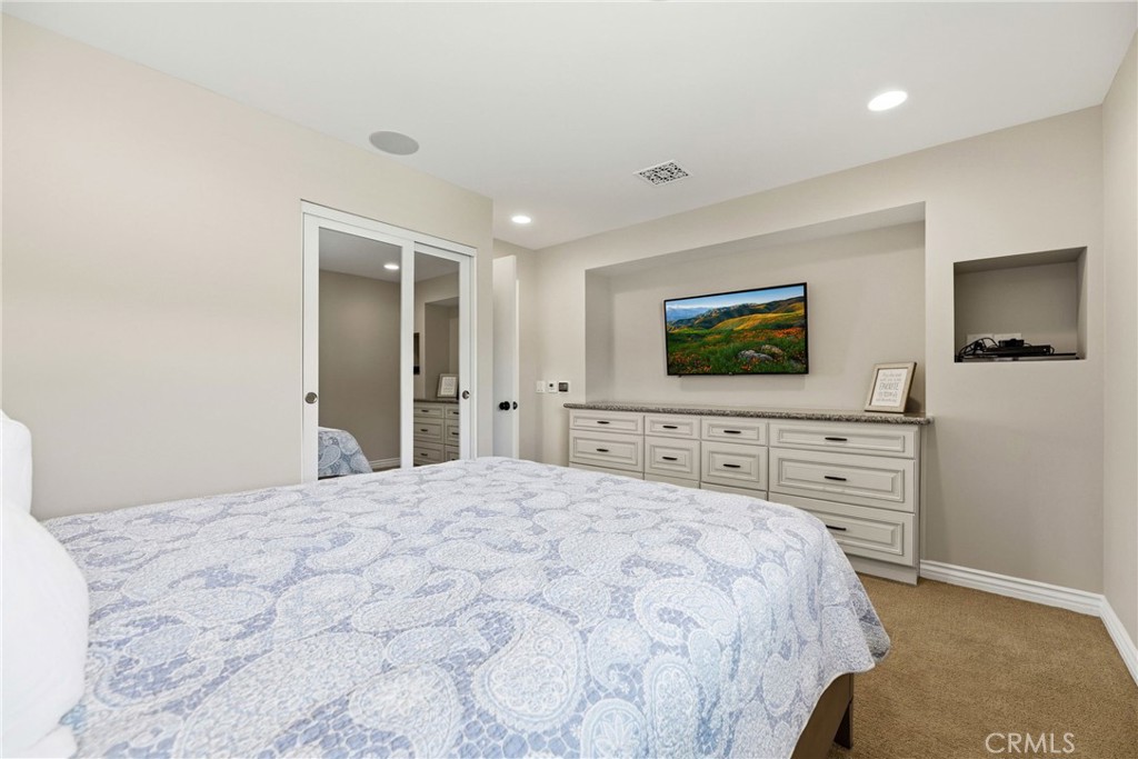 930 La Rue Avenue, Unit RUE La Verne, CA 91750 - Photo 34 of 63 a bedroom with a bed and a flat screen tv