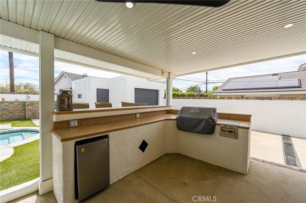 930 La Rue Avenue, Unit RUE La Verne, CA 91750 - Photo 42 of 63 a kitchen with stainless steel appliances granite countertop a sink and a stove