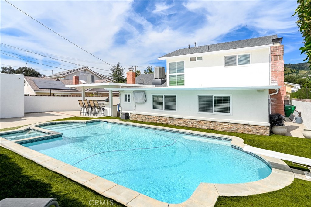930 La Rue Avenue, Unit RUE La Verne, CA 91750 - Photo 49 of 63 a view of a house with pool and chairs