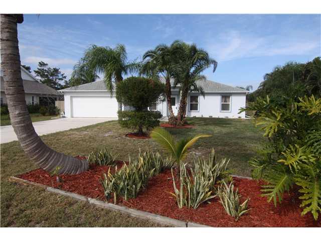 5459 Southeast Horseshoe Point Road Stuart, FL 34997 - Photo 1 of 14 a view of a house with a yard