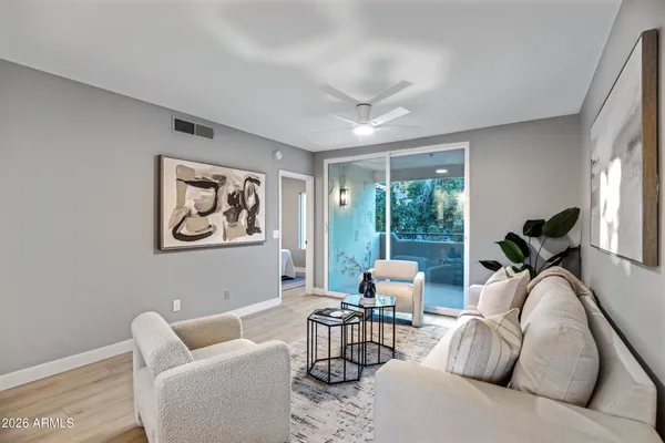 a living room with furniture and a large window