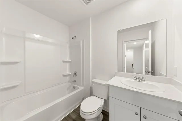 a bathroom with a sink a toilet and a bathtub