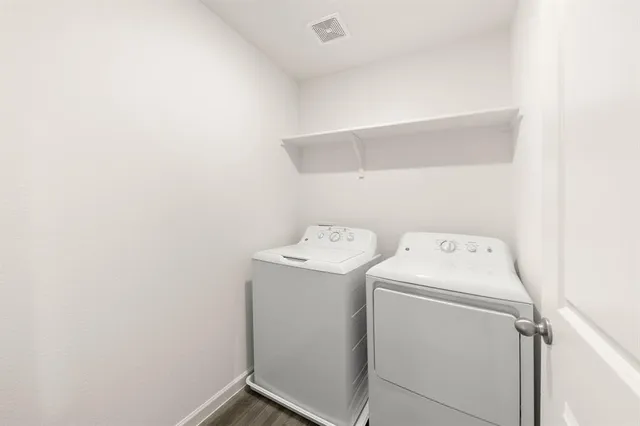 a utility room with dryer and washer