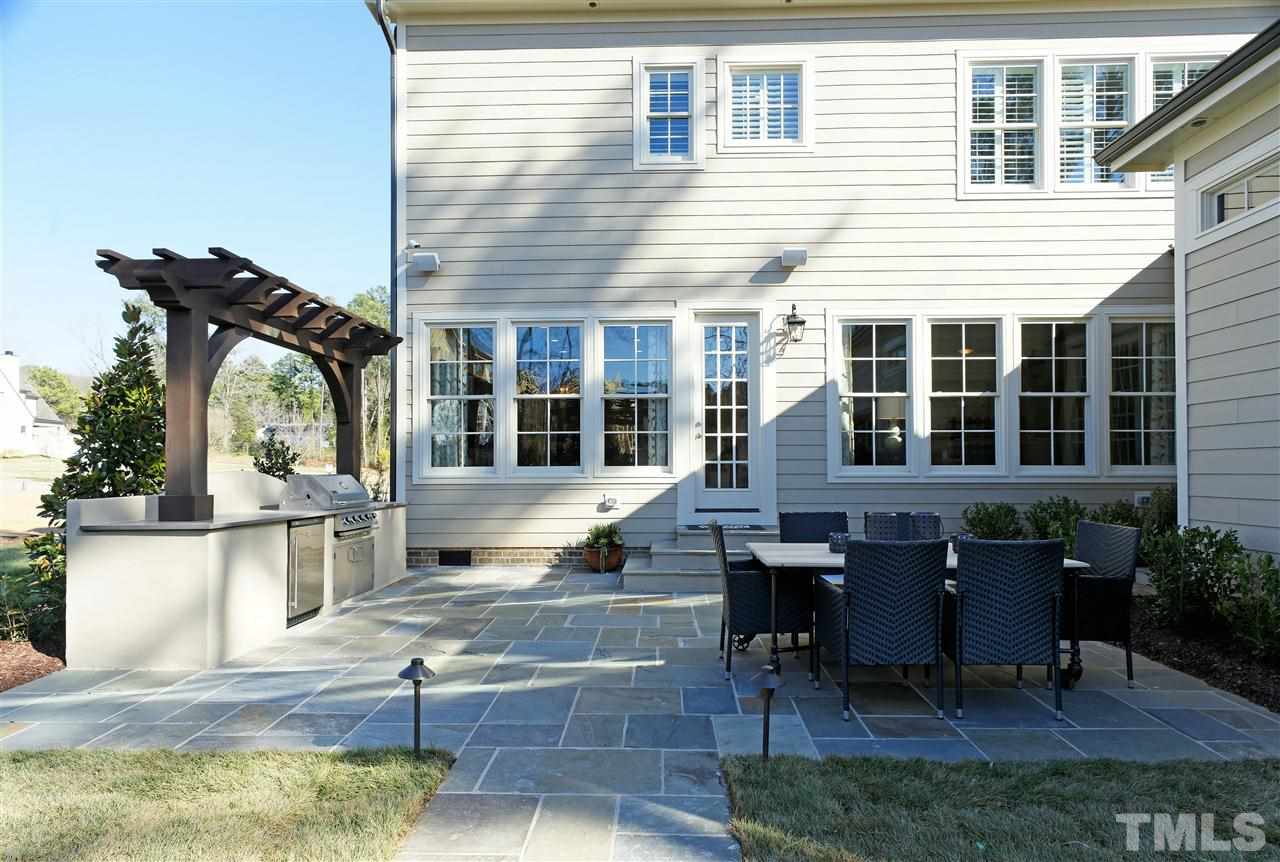 3623 Rolston Drive, Unit 9 Raleigh, NC 27609 - Photo 22 of 25 a front view of residential houses with outdoor seating