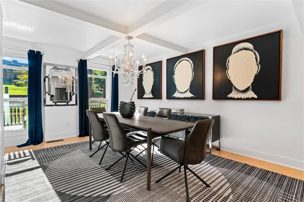 3519 Prince George Street Atlanta, GA 30344 - Photo 12 of 58 a view of a a dining room with furniture and chandelier