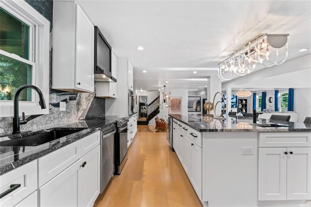 3519 Prince George Street Atlanta, GA 30344 - Photo 14 of 58 a kitchen with stainless steel appliances granite countertop a sink and cabinets