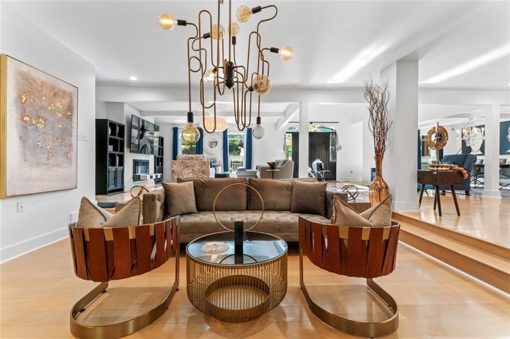 3519 Prince George Street Atlanta, GA 30344 - Photo 19 of 58 a living room with furniture a chandelier and glass door