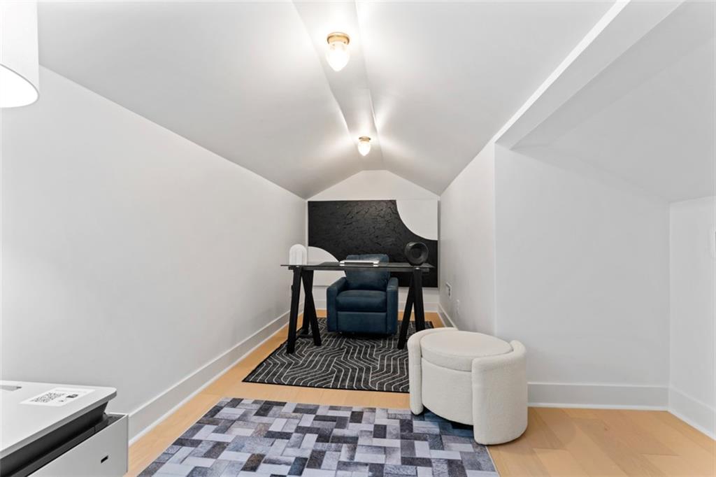 3519 Prince George Street Atlanta, GA 30344 - Photo 33 of 58 a bedroom with a bed and a chandelier