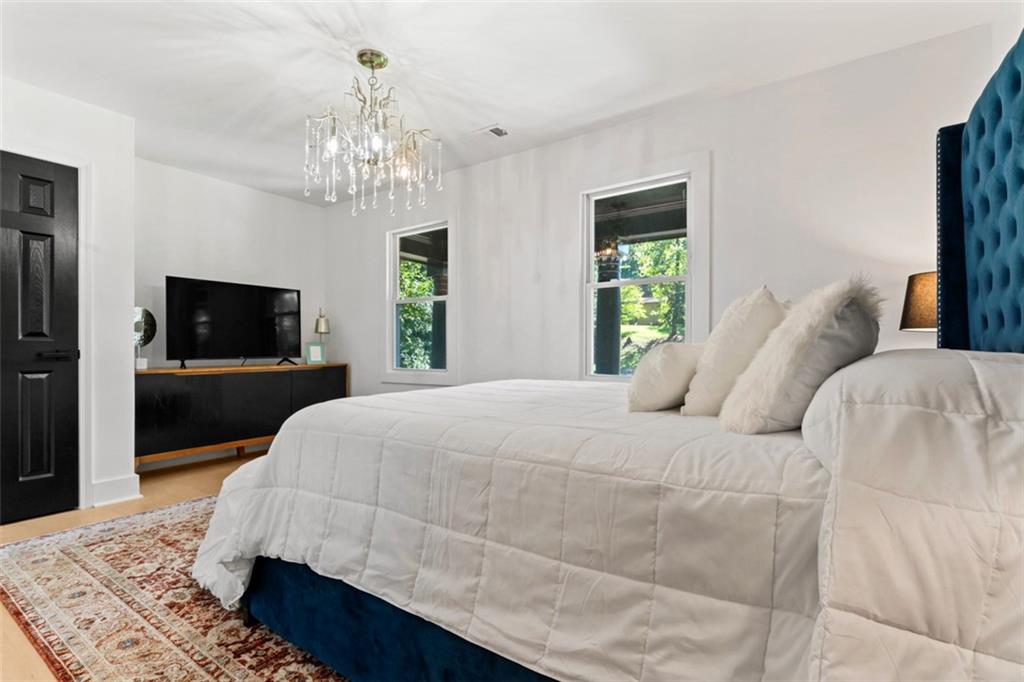 3519 Prince George Street Atlanta, GA 30344 - Photo 34 of 58 a bedroom with a bed and a flat screen tv