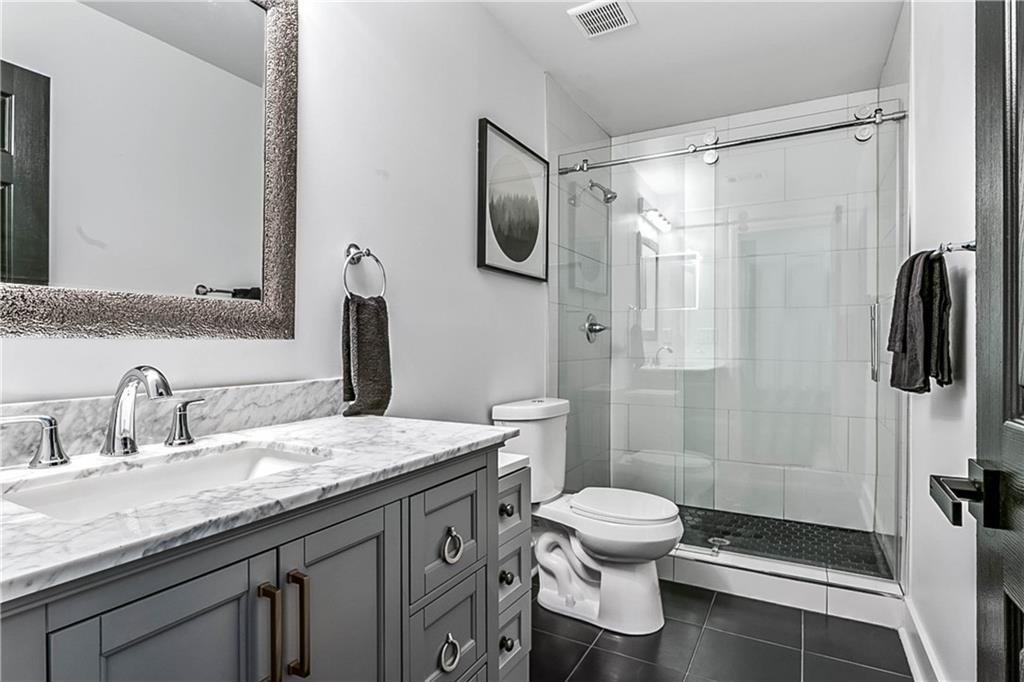 3519 Prince George Street Atlanta, GA 30344 - Photo 35 of 58 a bathroom with a granite countertop sink toilet and shower