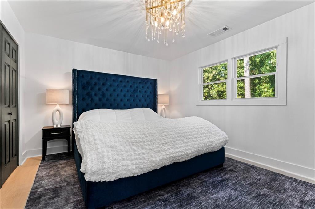 3519 Prince George Street Atlanta, GA 30344 - Photo 39 of 58 a bed sitting in a bedroom next to a window