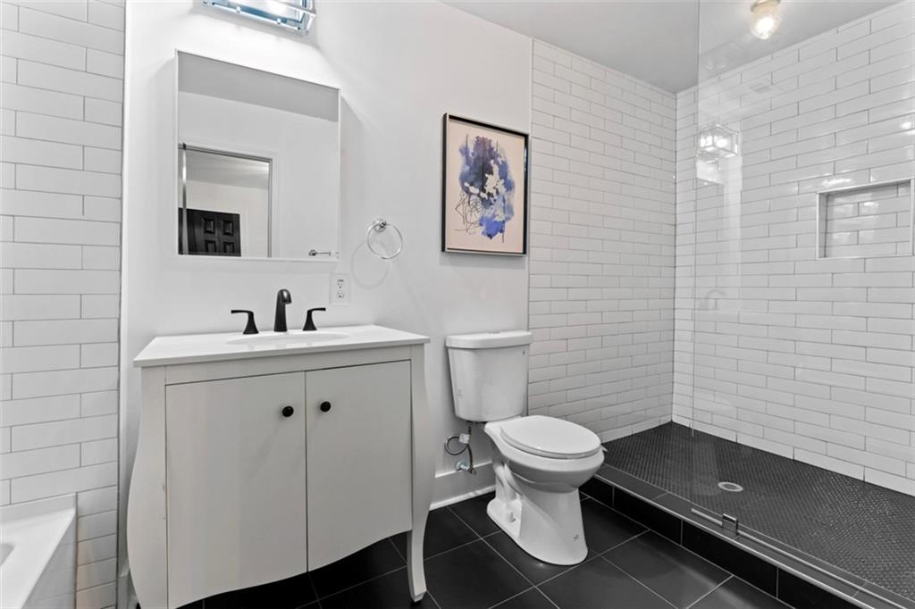 3519 Prince George Street Atlanta, GA 30344 - Photo 40 of 58 a bathroom with a toilet sink and mirror
