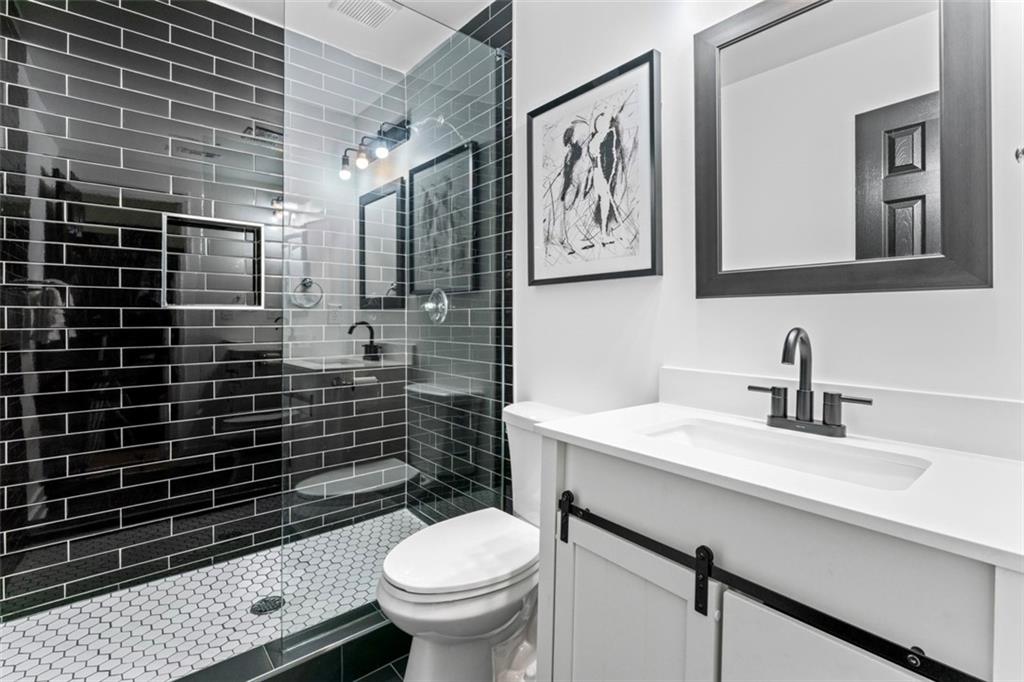 3519 Prince George Street Atlanta, GA 30344 - Photo 42 of 58 a bathroom with a sink toilet and shower