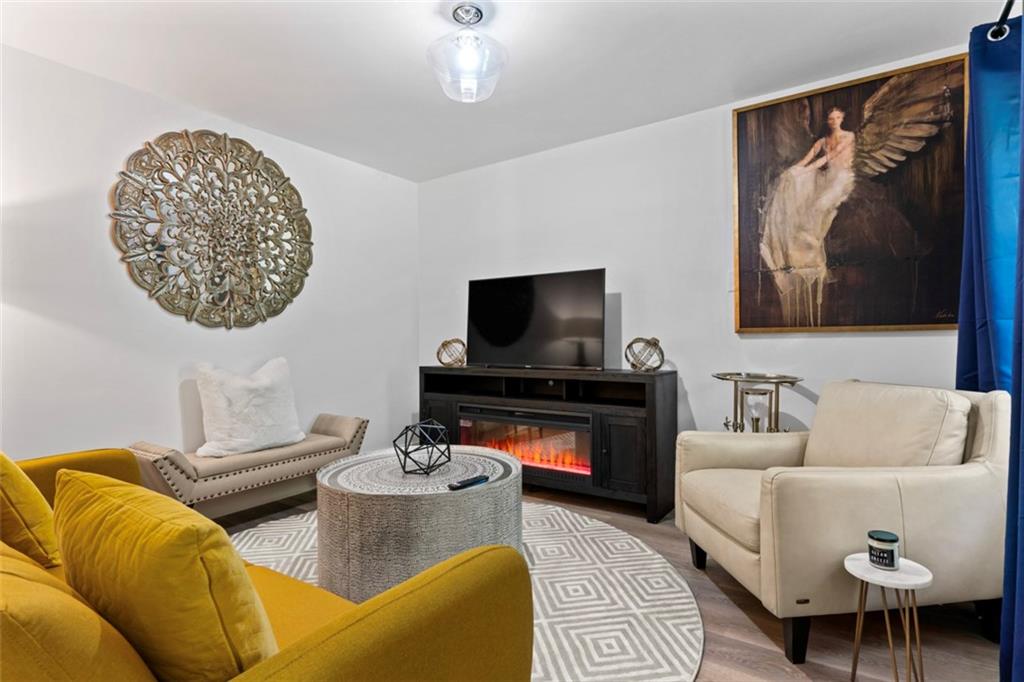 3519 Prince George Street Atlanta, GA 30344 - Photo 46 of 58 a living room with furniture and a flat screen tv