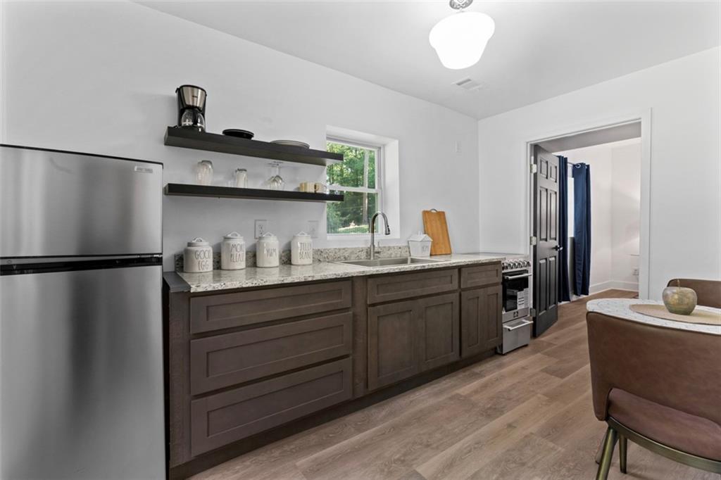 3519 Prince George Street Atlanta, GA 30344 - Photo 47 of 58 a kitchen with stainless steel appliances a sink and a refrigerator
