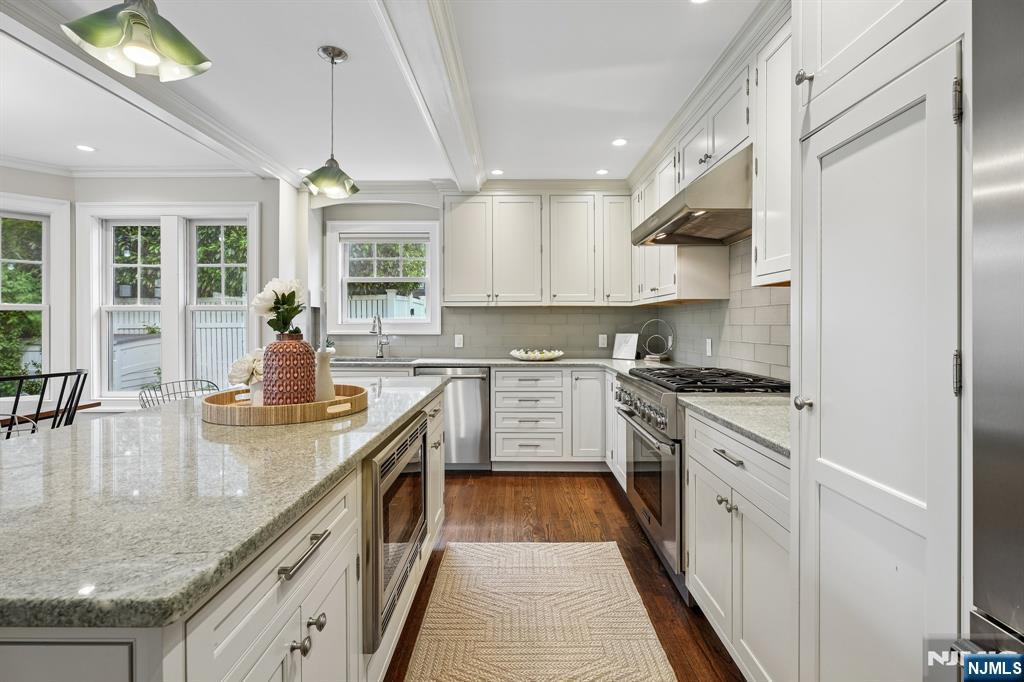 11 Mt Vernon Road Montclair, NJ 07043 - Photo 7 of 49 a kitchen with kitchen island granite countertop lots of counter top space and a sink