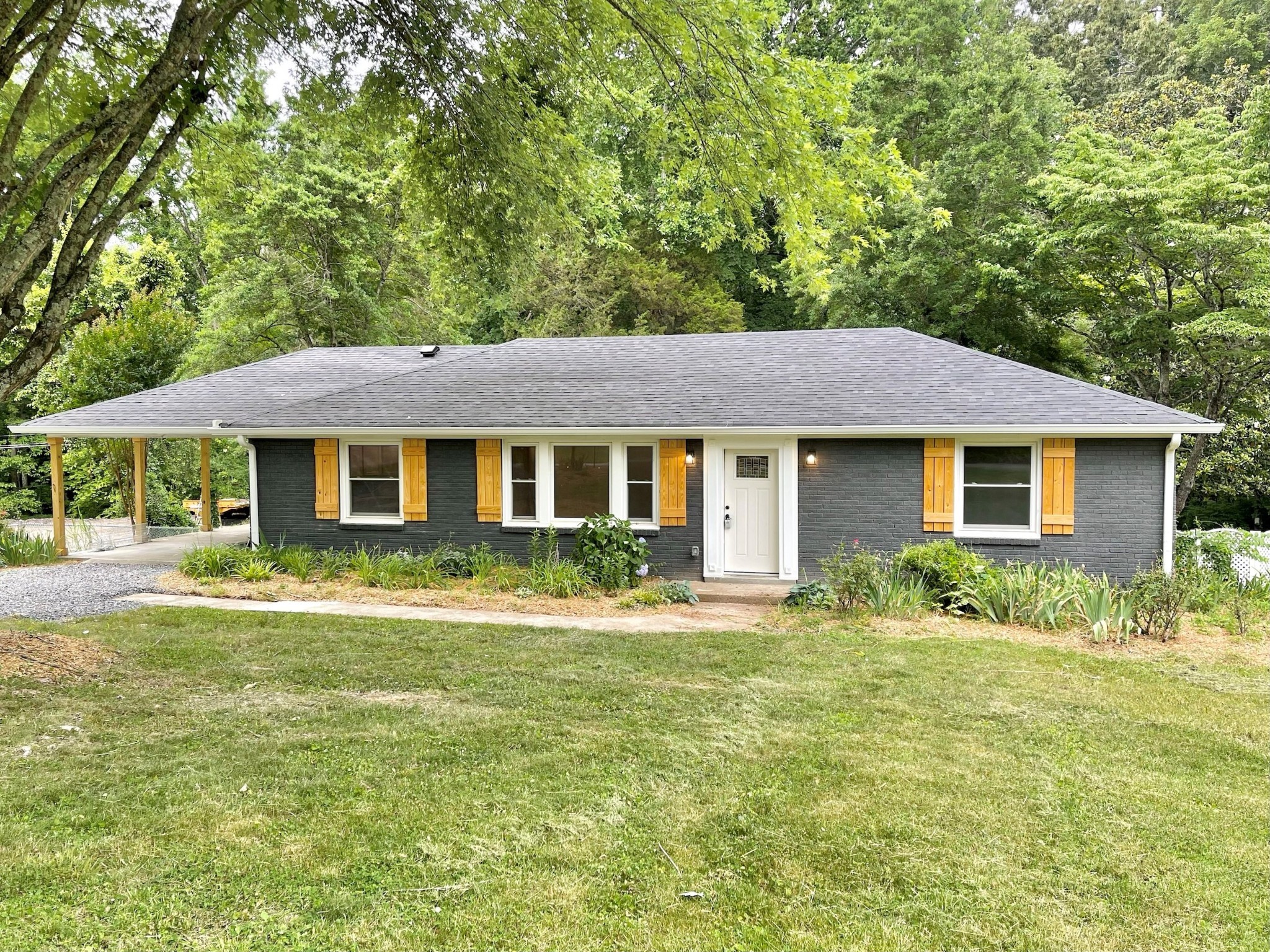 a front view of a house with a yard