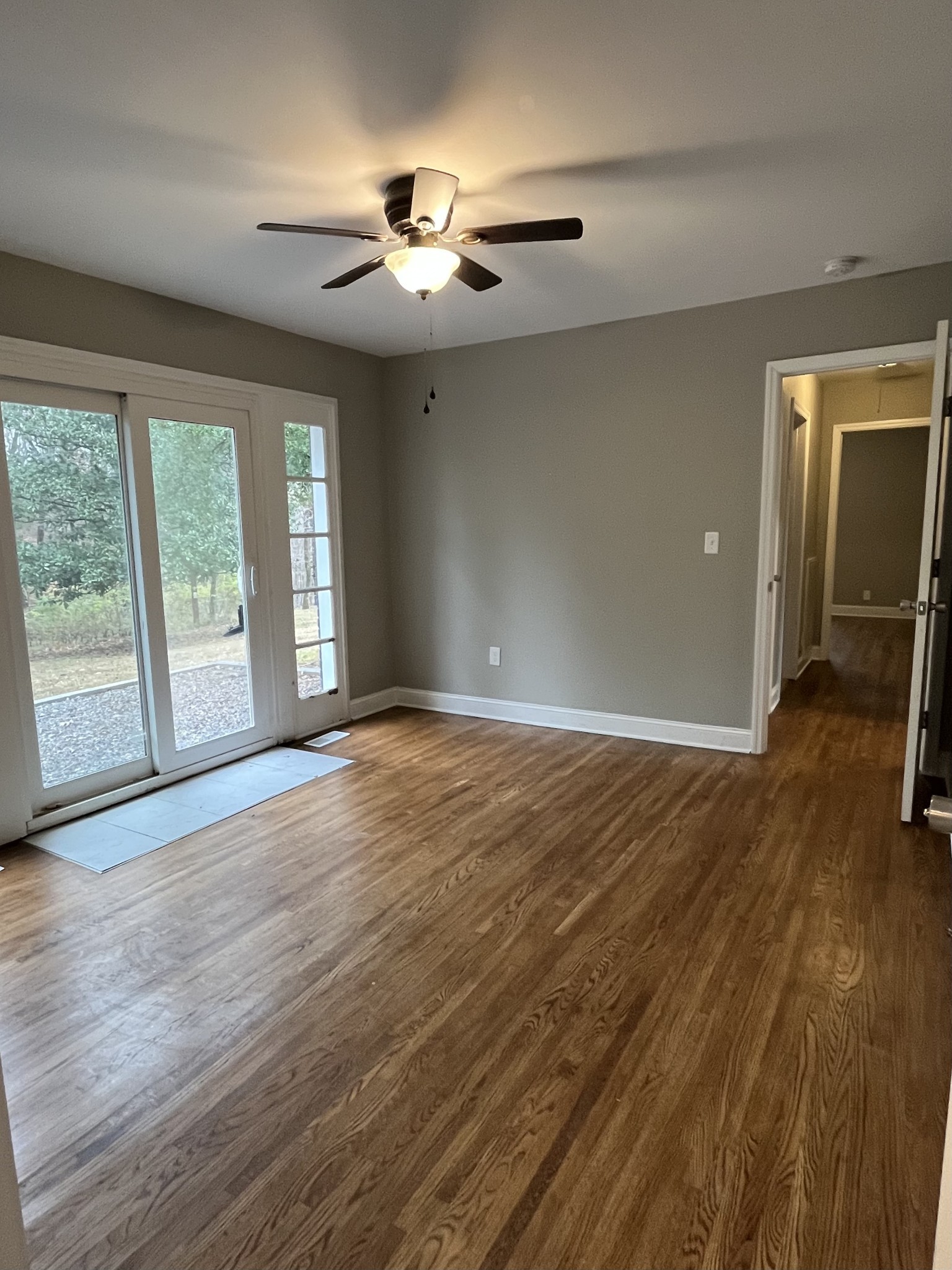 1690 Valley Road Clarksville, TN 37043 - Photo 10 of 16 a view of an empty room with wooden floor and a window