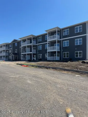 a front view of residential houses with yard