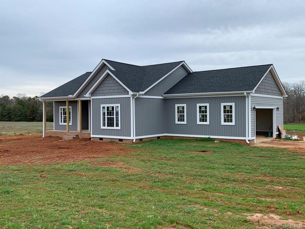 545 Gatton Road Cleveland, NC 27013 - Photo 1 of 27 a front view of a house with a garden