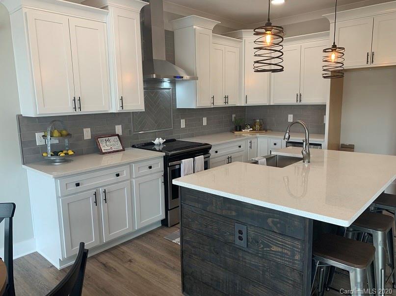 545 Gatton Road Cleveland, NC 27013 - Photo 11 of 27 a kitchen with a sink a stove and cabinets