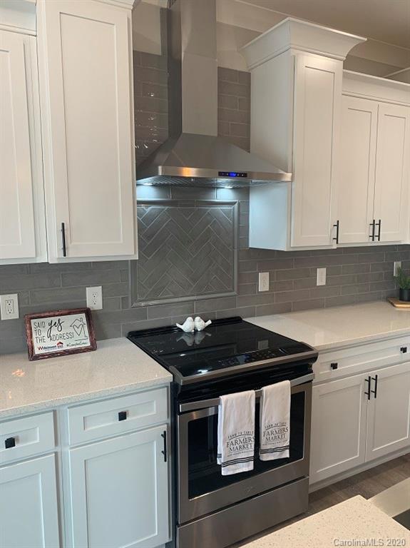 545 Gatton Road Cleveland, NC 27013 - Photo 12 of 27 a kitchen with a stove and cabinets