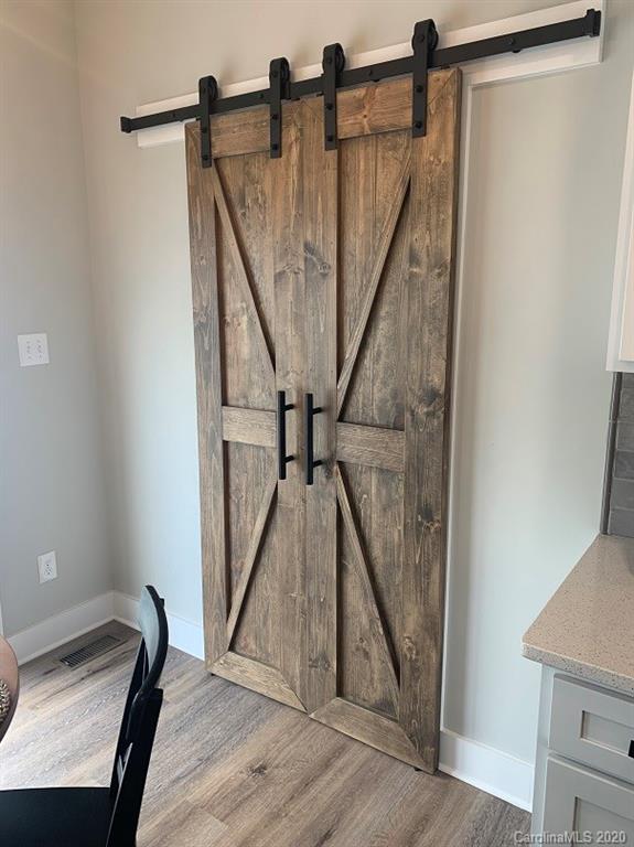 545 Gatton Road Cleveland, NC 27013 - Photo 14 of 27 a view of entryway and hall with wooden floor