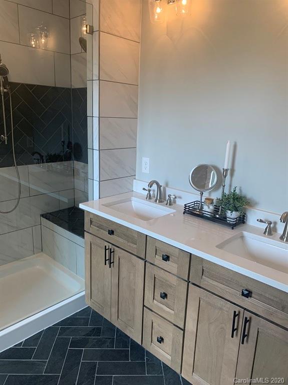 545 Gatton Road Cleveland, NC 27013 - Photo 20 of 27 a sink with granite countertop a sink and cabinets