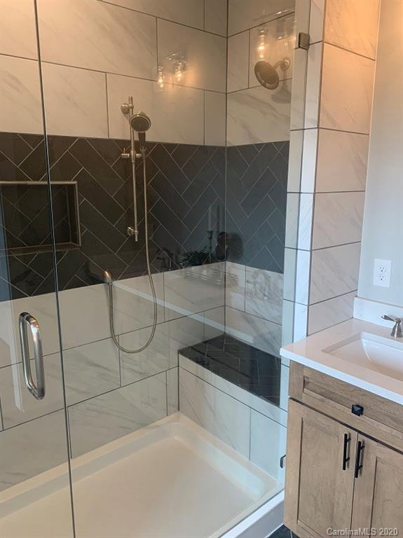 545 Gatton Road Cleveland, NC 27013 - Photo 22 of 27 a bathroom with a shower and a sink