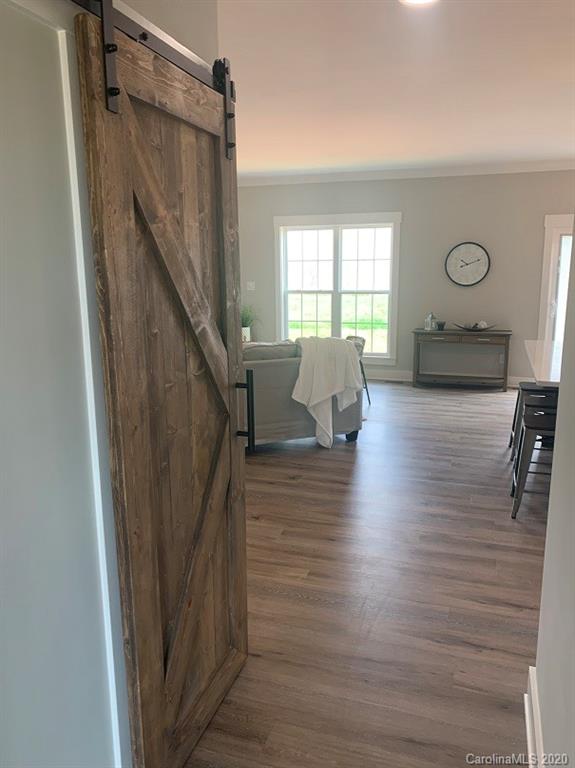 545 Gatton Road Cleveland, NC 27013 - Photo 23 of 27 a living room with furniture and a wooden floor