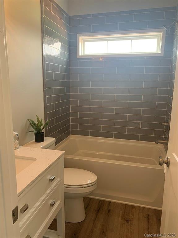 545 Gatton Road Cleveland, NC 27013 - Photo 25 of 27 a bathroom with a sink a toilet and shower