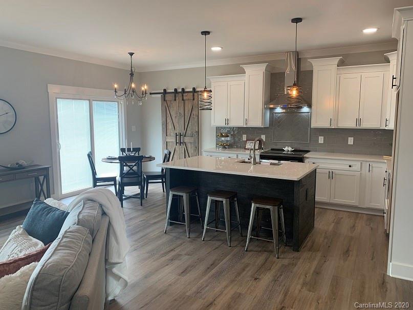 545 Gatton Road Cleveland, NC 27013 - Photo 6 of 27 a large kitchen with a table and chairs