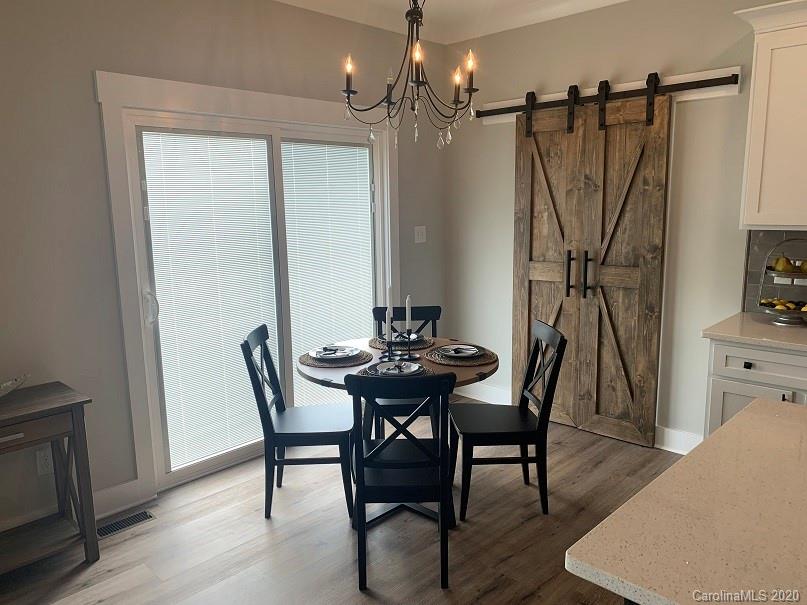 545 Gatton Road Cleveland, NC 27013 - Photo 9 of 27 a view of a dining room with furniture and wooden floor