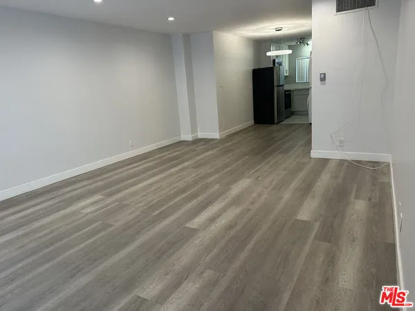 a view of a big room with wooden floor