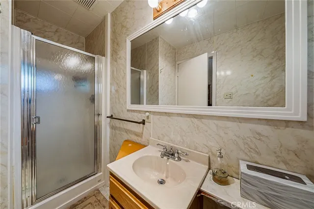 a bathroom with a sink and mirror