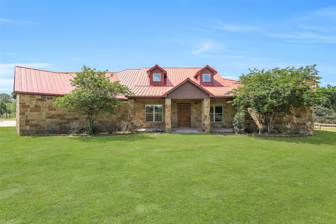 41545 Farm To Market 3346 Hempstead, TX 77445 - Photo 2 of 49 a front view of a house with a garden