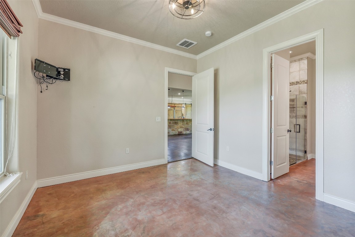 41545 Farm To Market 3346 Hempstead, TX 77445 - Photo 24 of 49 a view of an empty room with wooden floor and a bathroom
