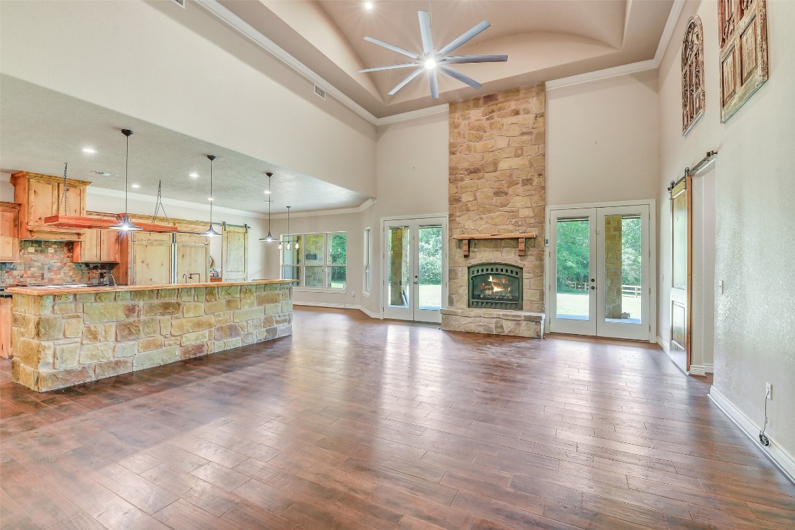 41545 Farm To Market 3346 Hempstead, TX 77445 - Photo 26 of 49 an empty room with wooden floor and fireplace