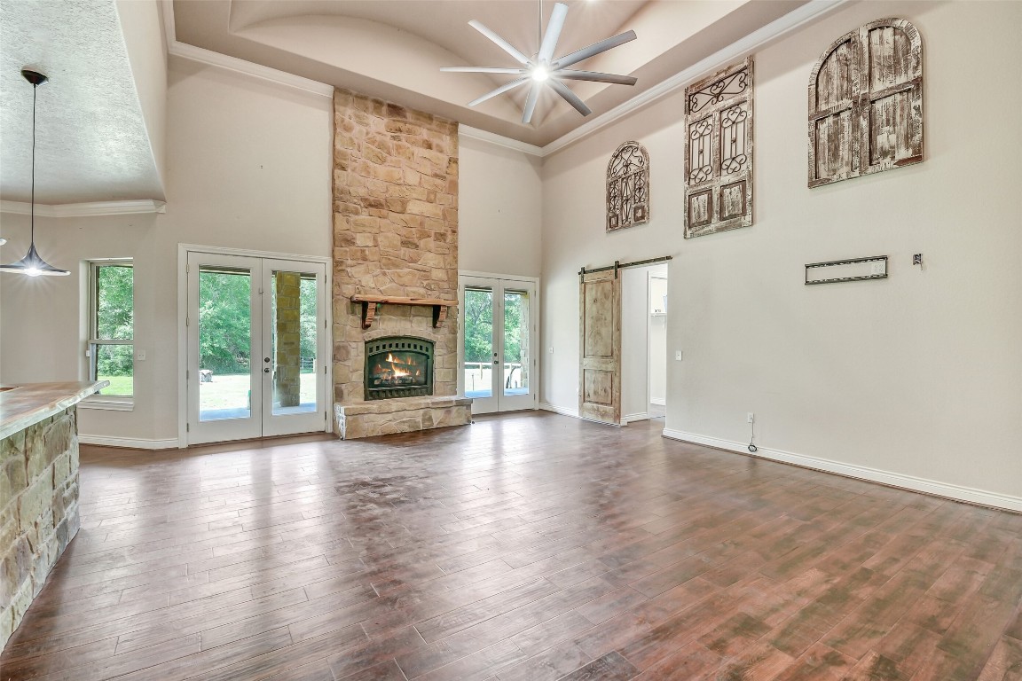 41545 Farm To Market 3346 Hempstead, TX 77445 - Photo 27 of 49 a view of a livingroom with wooden floor a fireplace and window