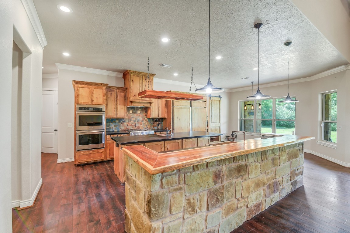 41545 Farm To Market 3346 Hempstead, TX 77445 - Photo 29 of 49 a large kitchen with kitchen island a large counter top and stainless steel appliances