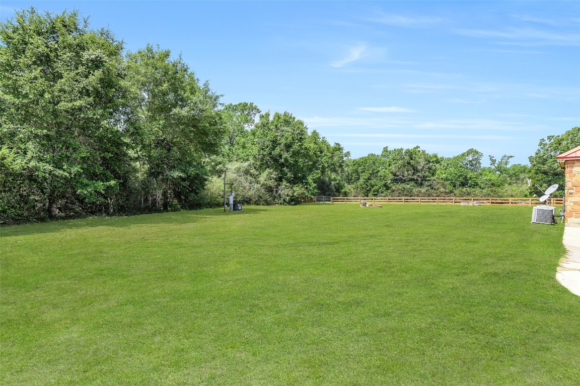 41545 Farm To Market 3346 Hempstead, TX 77445 - Photo 38 of 49 a view of a garden with a lake