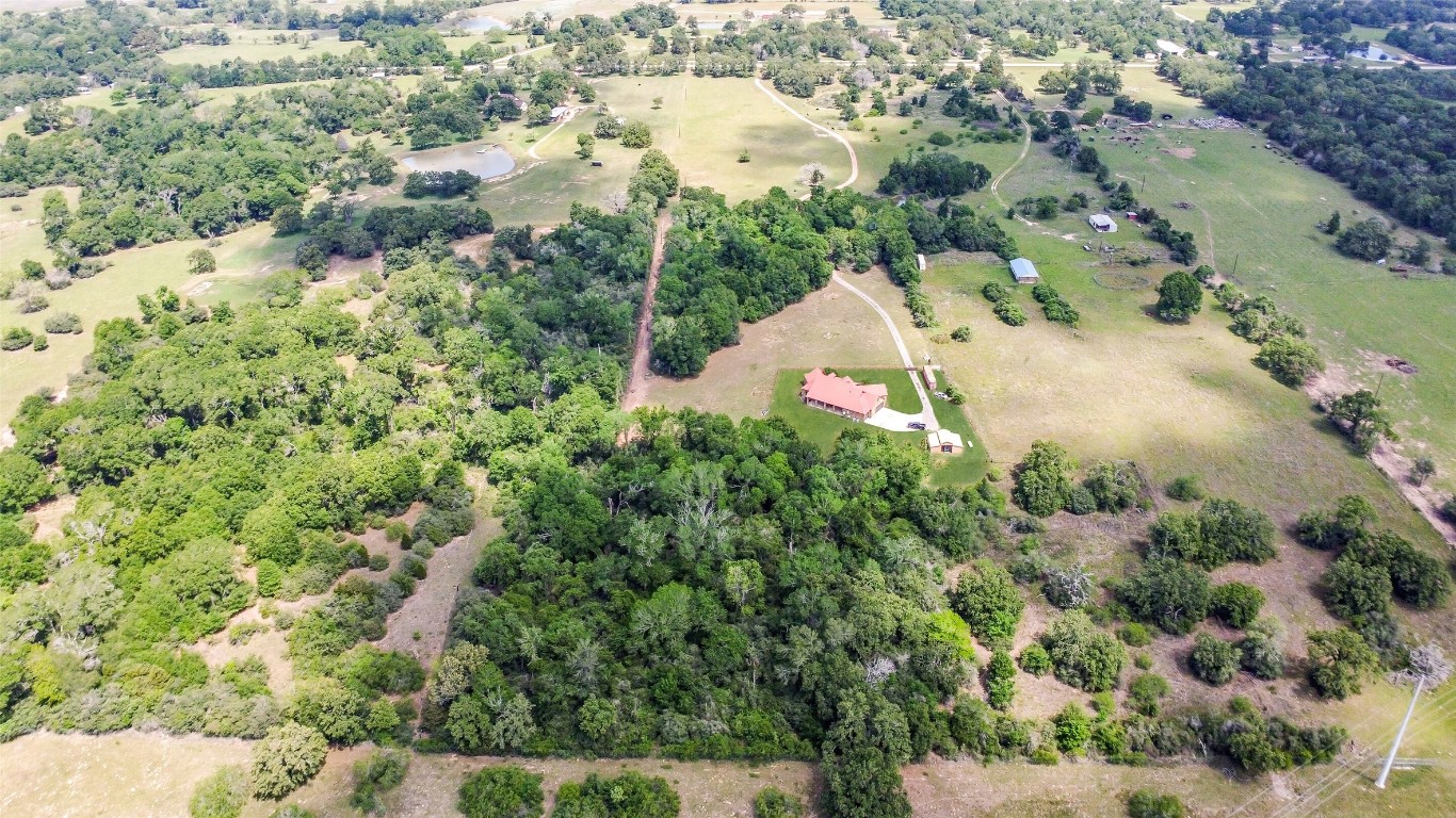 41545 Farm To Market 3346 Hempstead, TX 77445 - Photo 42 of 49 an aerial view of a house with a yard and large trees