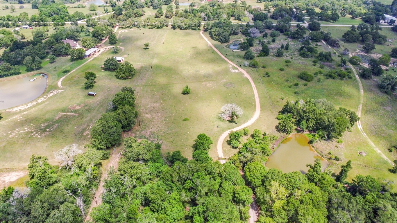 41545 Farm To Market 3346 Hempstead, TX 77445 - Photo 43 of 49 an aerial view of a residential houses with swimming pool and green space