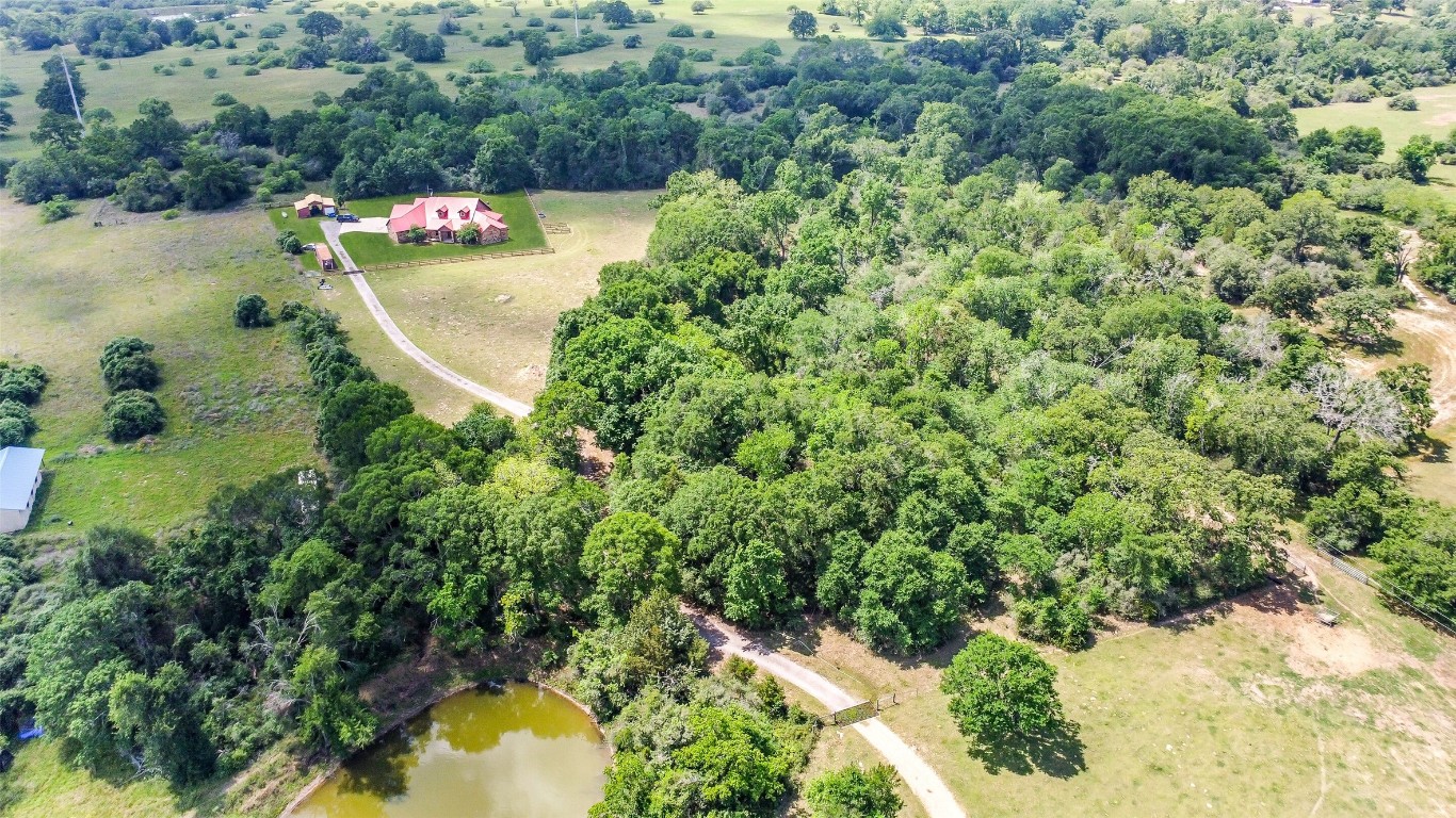 41545 Farm To Market 3346 Hempstead, TX 77445 - Photo 47 of 49 an aerial view of a house with a yard and lake view