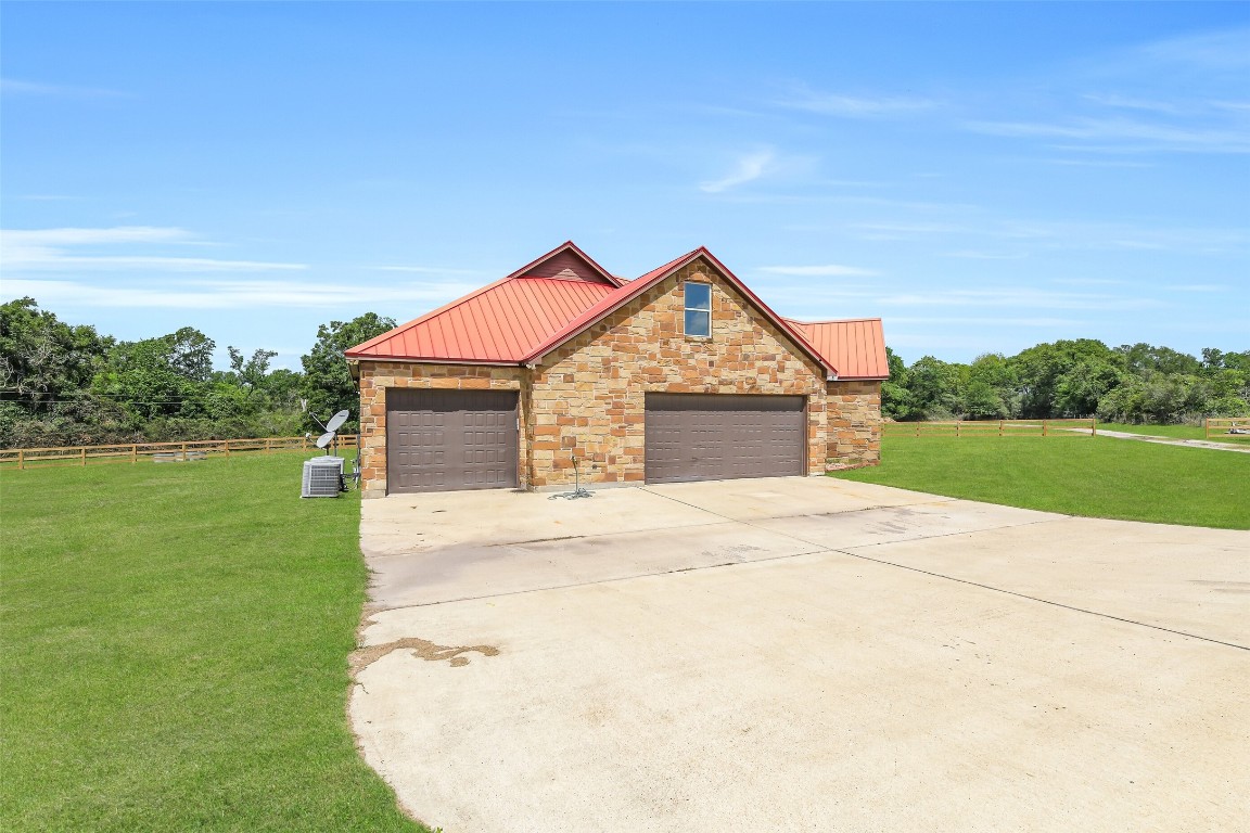 41545 Farm To Market 3346 Hempstead, TX 77445 - Photo 5 of 49 a front view of a house with a yard