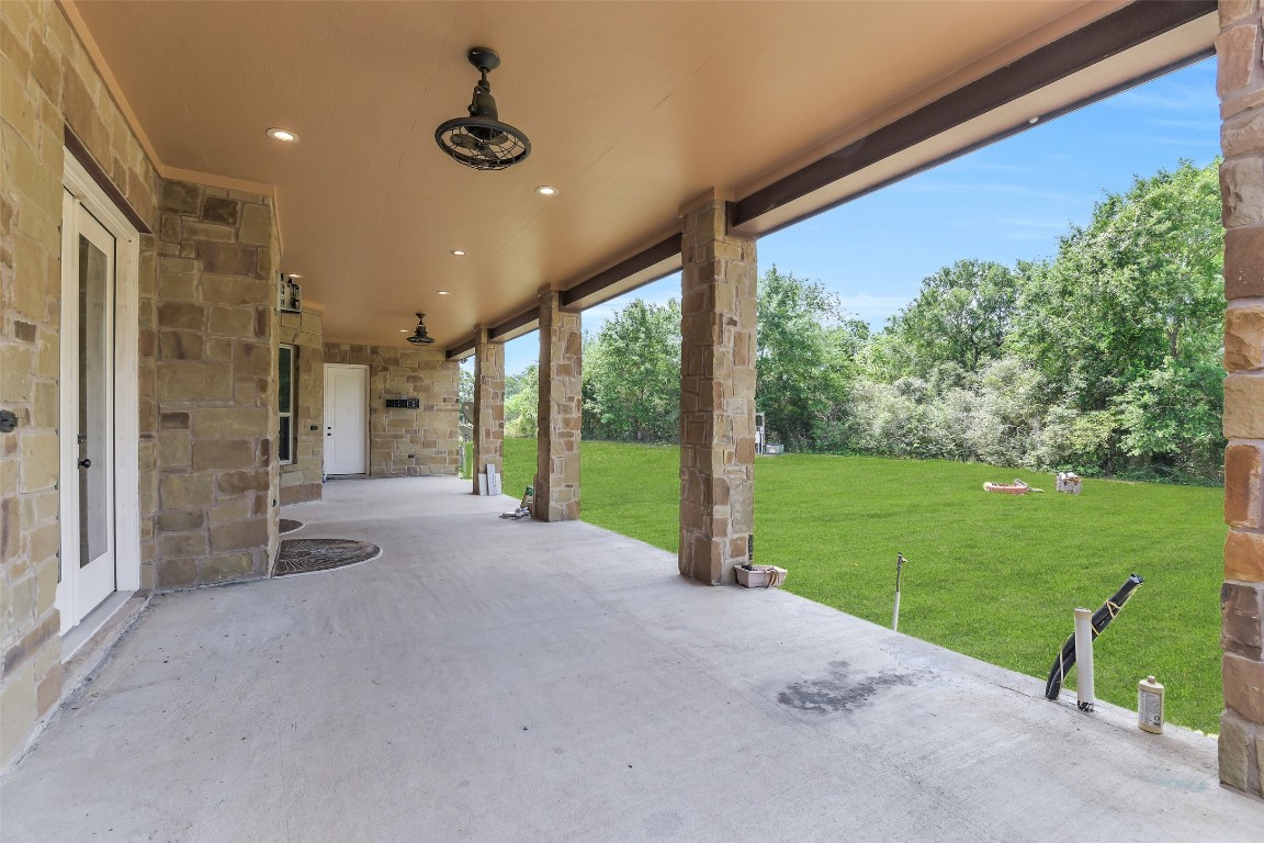 41545 Farm To Market 3346 Hempstead, TX 77445 - Photo 7 of 49 a view of an empty room with a floor to ceiling window and yard