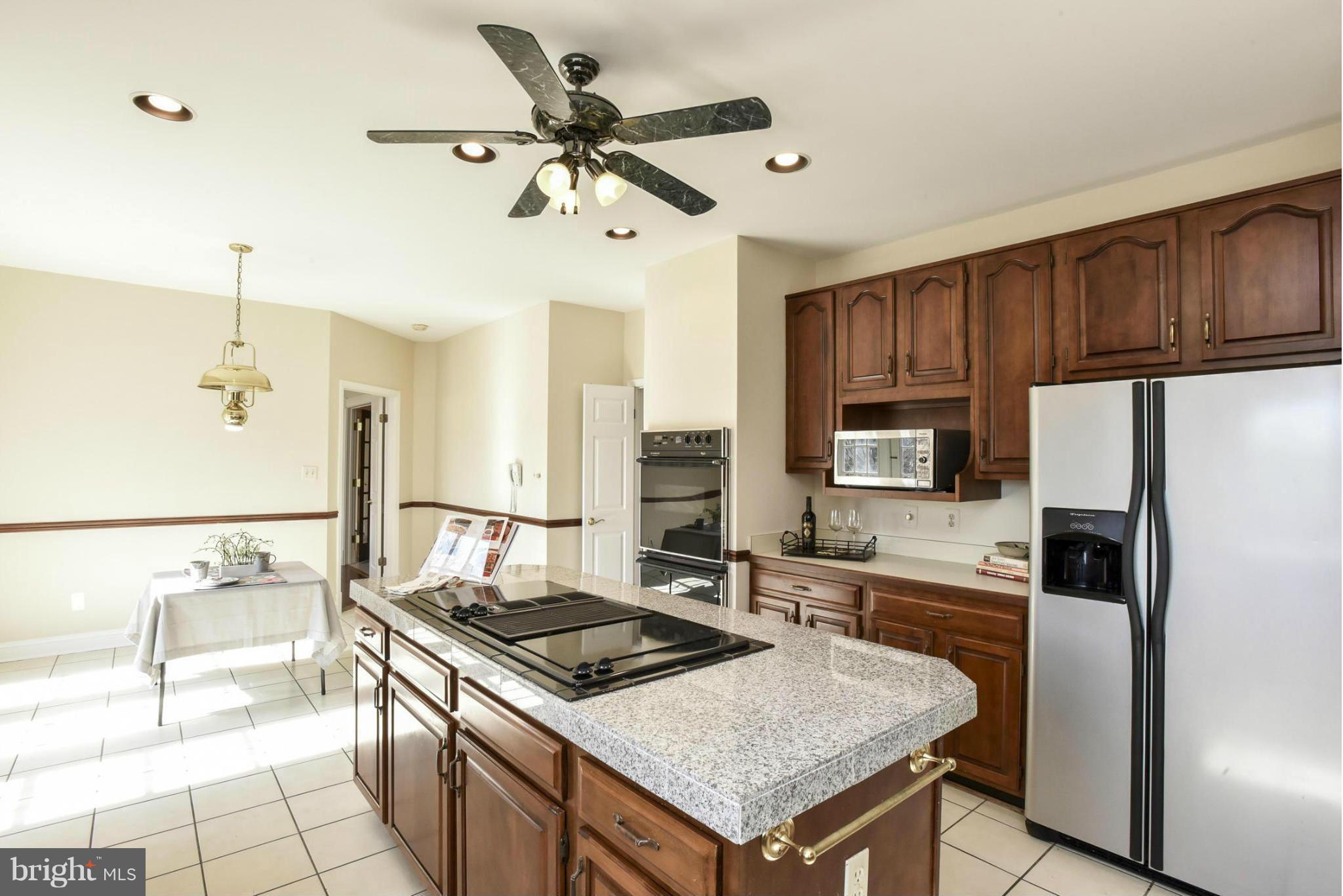 9723 Middleton Ridge Road Vienna, VA 22182 - Photo 11 of 30 Kitchen with stainless steel refrigerator