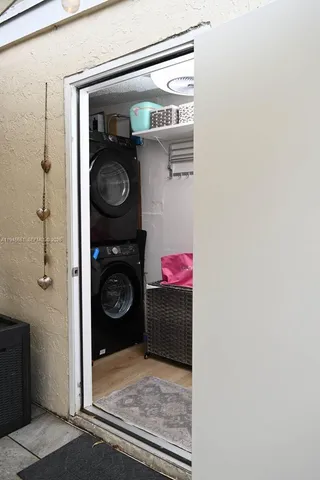 a room with a baby crib and a dresser