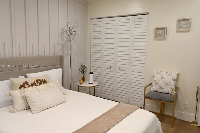 a bedroom with bed and a couch