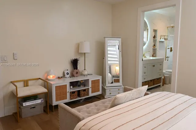 a bedroom with bed and a lamp